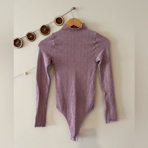 Free People purple stretchy bodysuit. Worn only twice. Excellent condition.